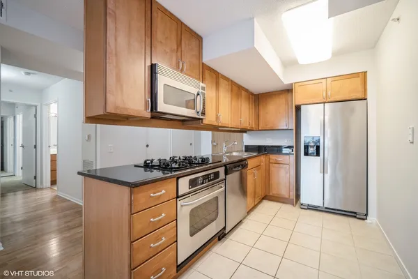 a view of a kitchen with furniture and a chandelier