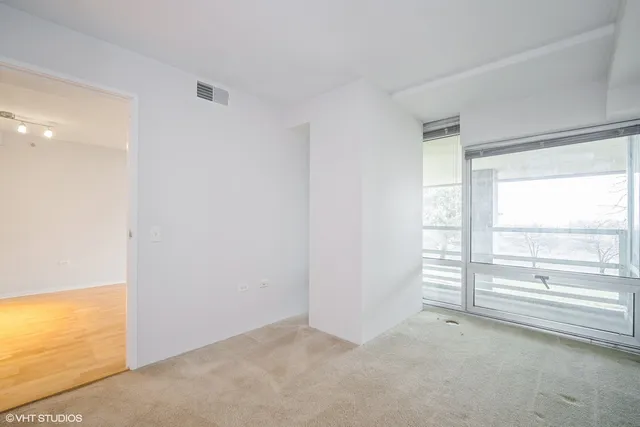 a spacious bathroom with a double vanity sink toilet and shower