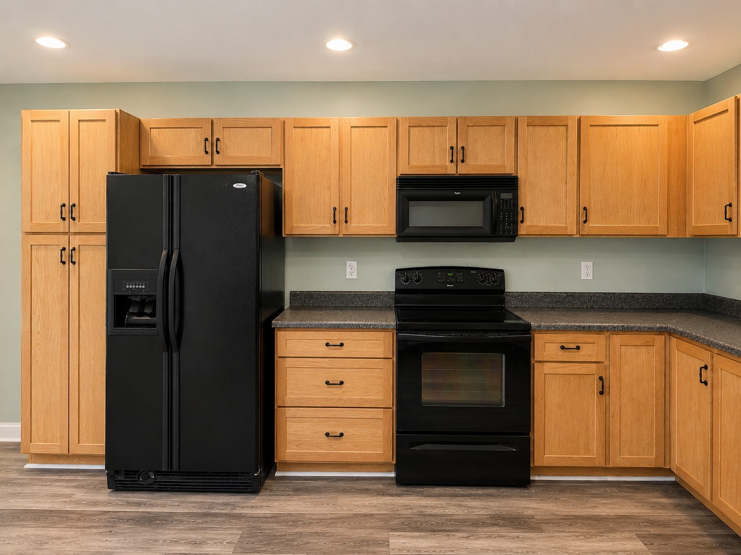 352 Main Street Cerulean, KY 42215 - Photo 10 of 32 a kitchen with granite countertop a refrigerator cabinets and a stove top oven