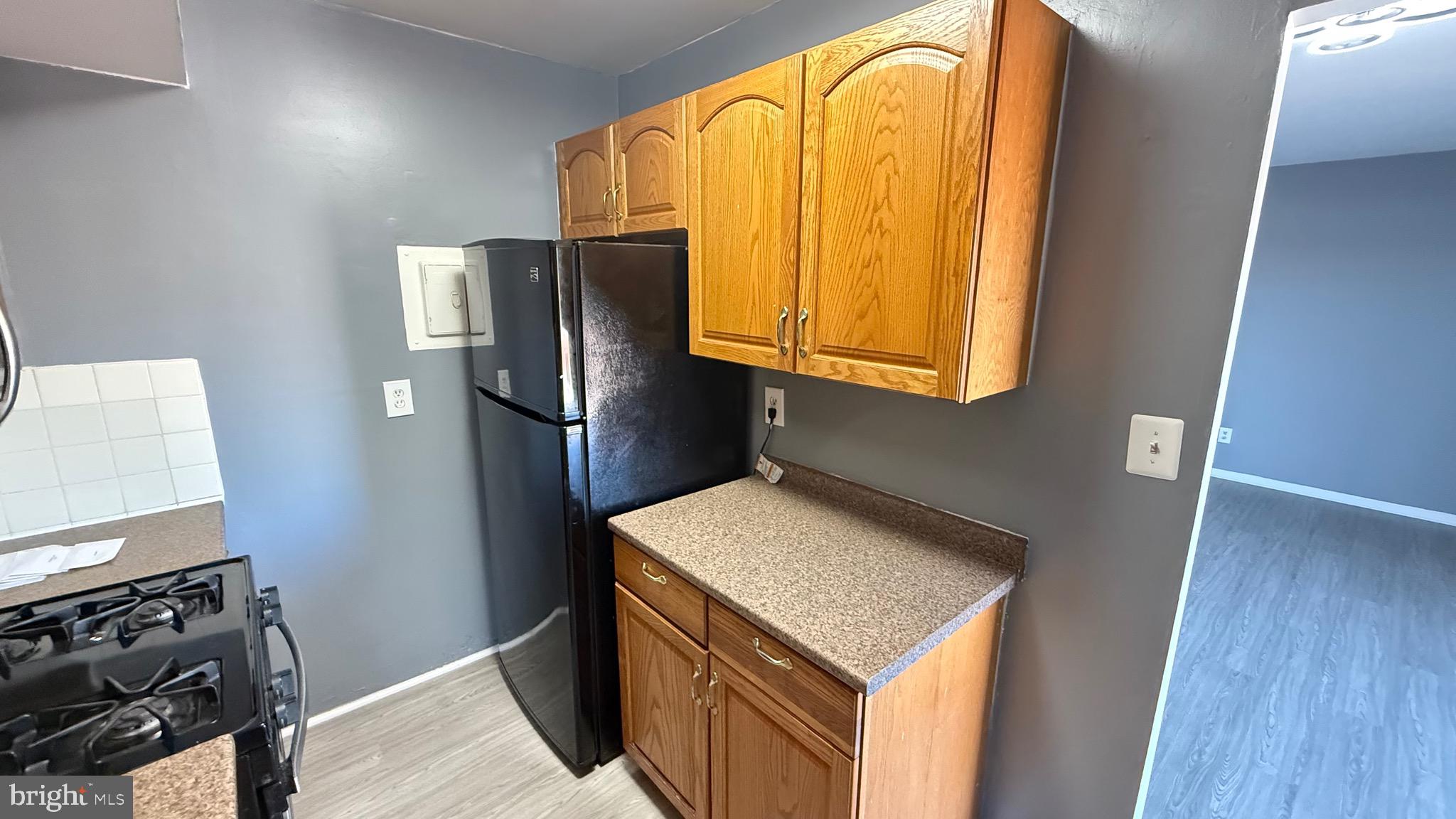 3400 25th Street South, Unit 27 Arlington, VA 22206 - Photo 11 of 23 a kitchen with stainless steel appliances granite countertop a refrigerator and a stove