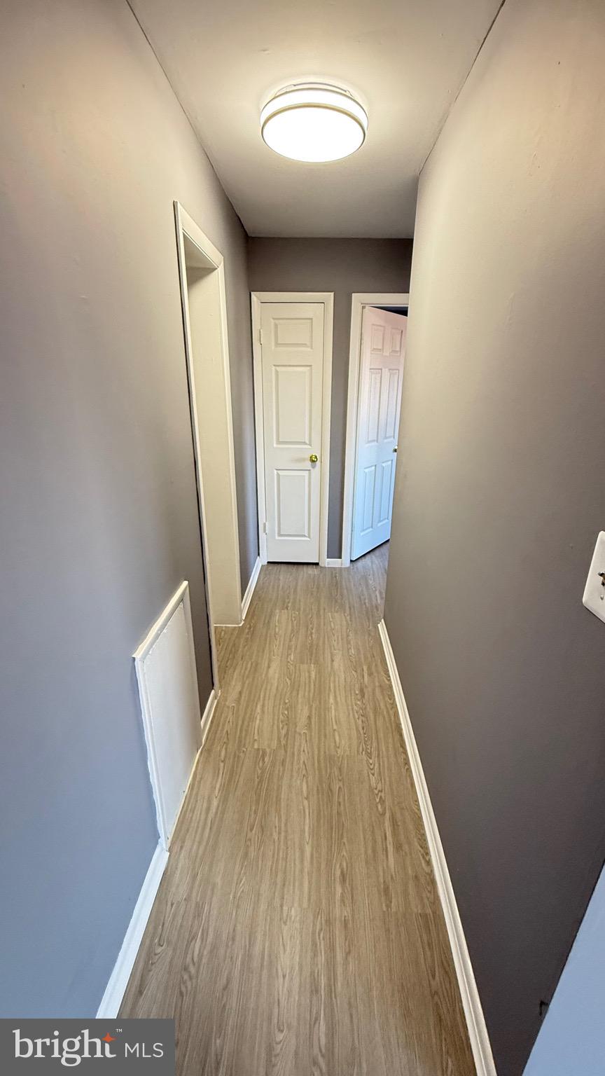 3400 25th Street South, Unit 27 Arlington, VA 22206 - Photo 12 of 23 wooden floor in an empty room with a window