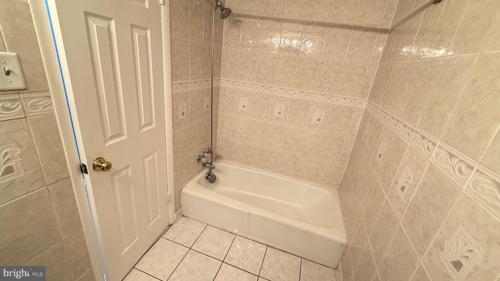 3400 25th Street South, Unit 27 Arlington, VA 22206 - Photo 14 of 23 a bathroom with a bathtub and a shower