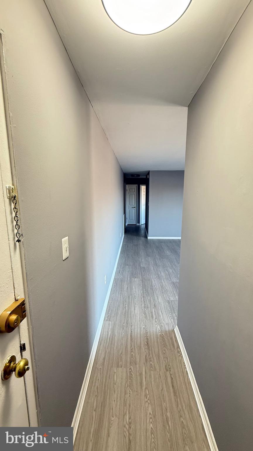 3400 25th Street South, Unit 27 Arlington, VA 22206 - Photo 5 of 23 a view of a room with wooden floor and a ceiling fan