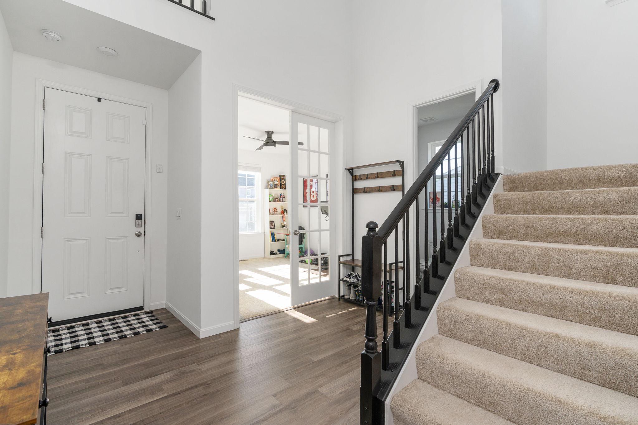6371 Pointer Lane King George, VA 22485 - Photo 4 of 38 a view of staircase with wooden floor and white walls