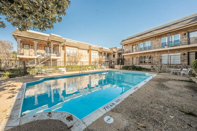 a view of swimming pool with outdoor seating