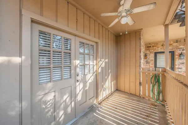 a view of a balcony with wooden floor