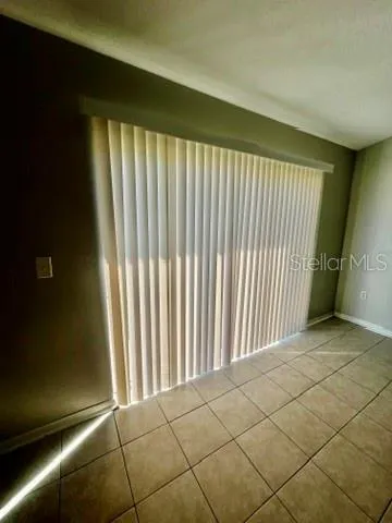 a view of an empty room and window