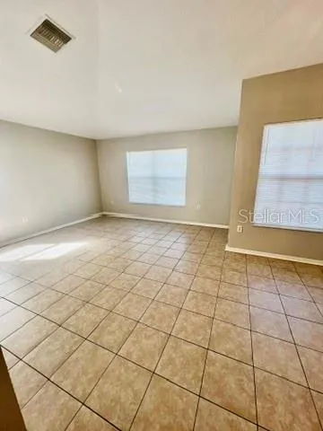 a view of an empty room and window