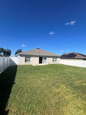 a view of a swimming pool and an outdoor space