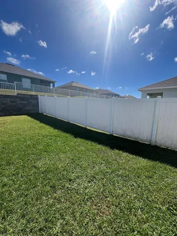 a view of an empty room with windows