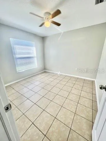 a view of an empty room and window