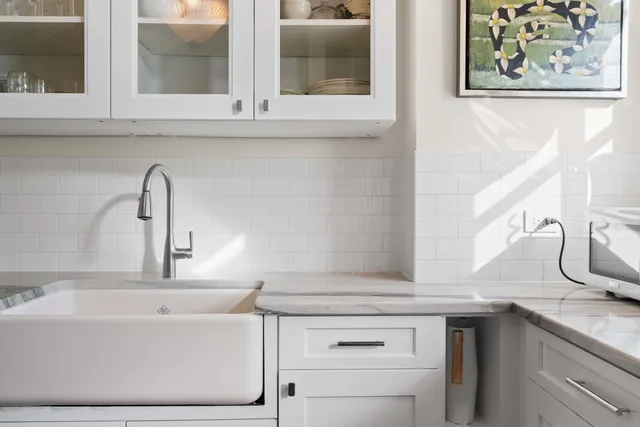a bathroom with a sink and a window