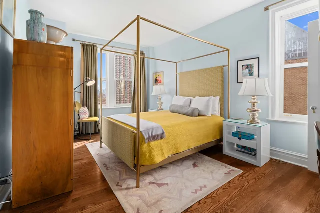 a bedroom with a bed and a walk in closet