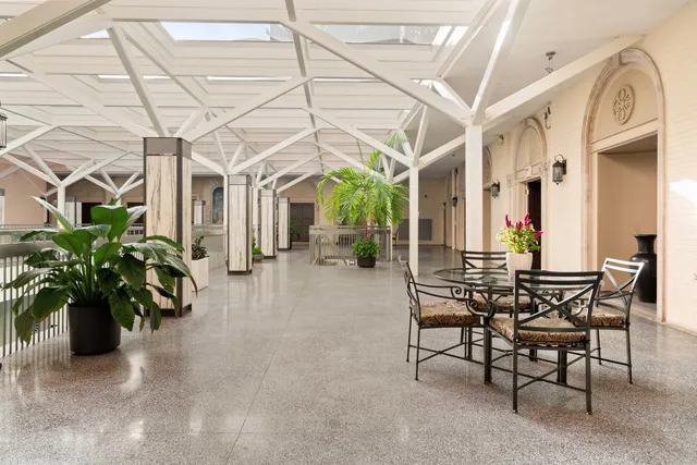 a view of a chairs and table in the patio
