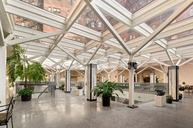 a view of a porch with a table and chairs