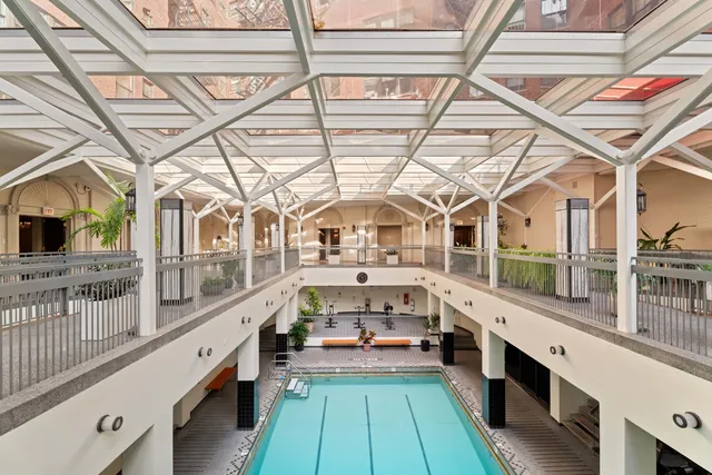 a view of a kitchen with a large window