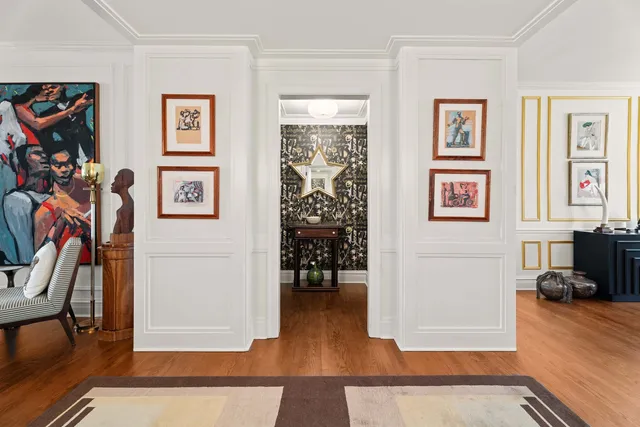 a view of a livingroom with furniture and gym equipment