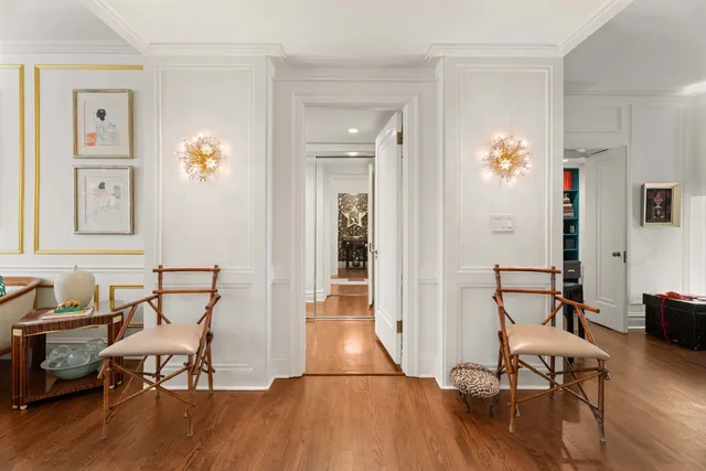 a view of a livingroom with furniture and hardwood floor