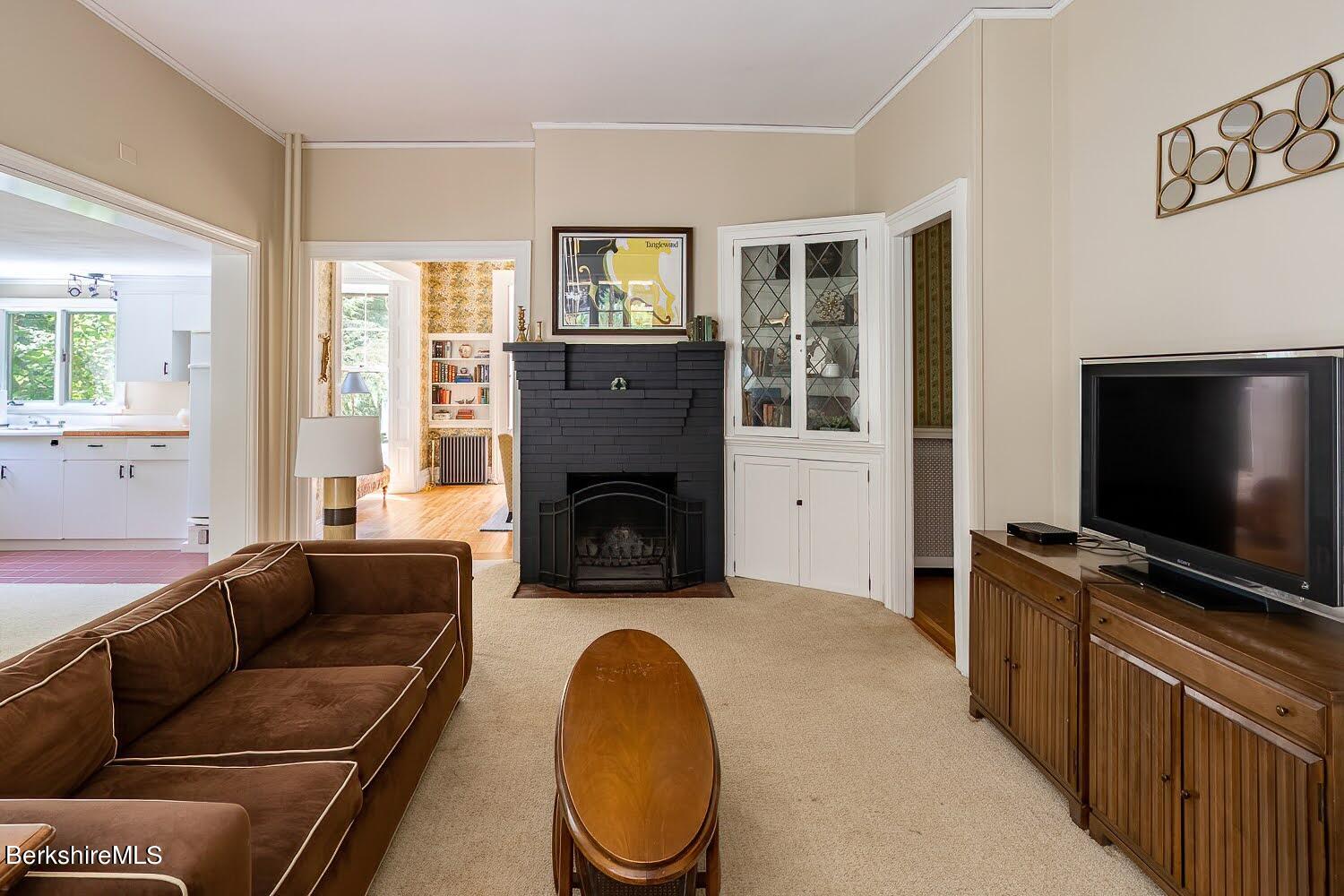 39 Main Street Stockbridge, MA 01262 - Photo 15 of 39 a living room with furniture a flat screen tv and a fireplace