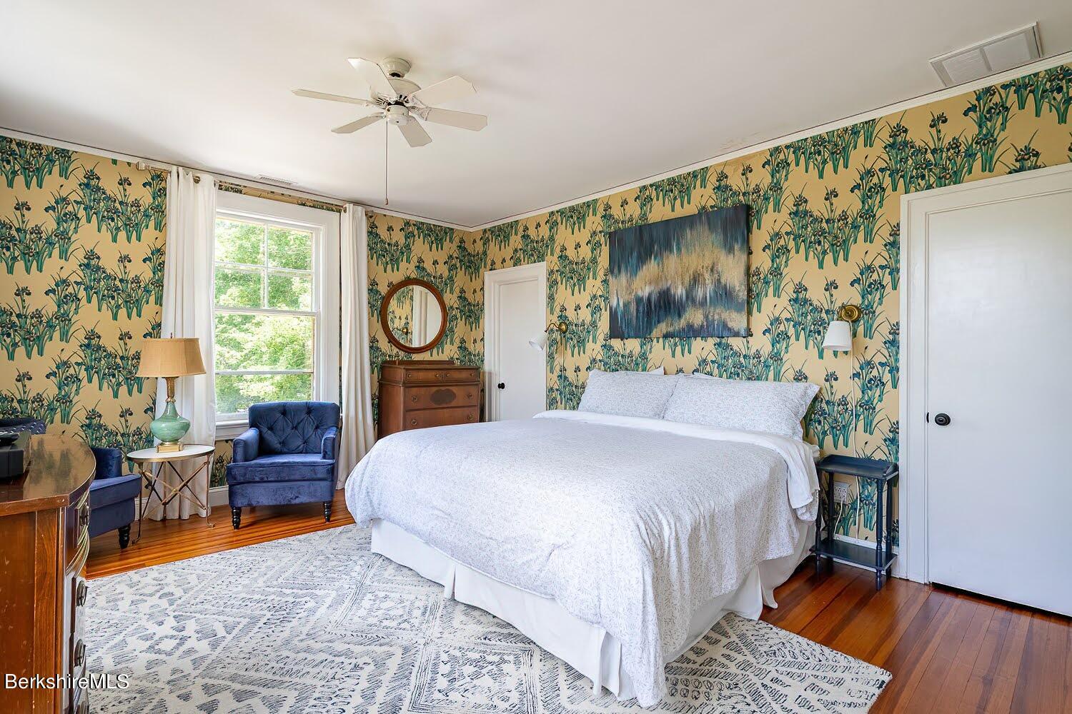 39 Main Street Stockbridge, MA 01262 - Photo 18 of 39 a bed room with a bed and a chandelier
