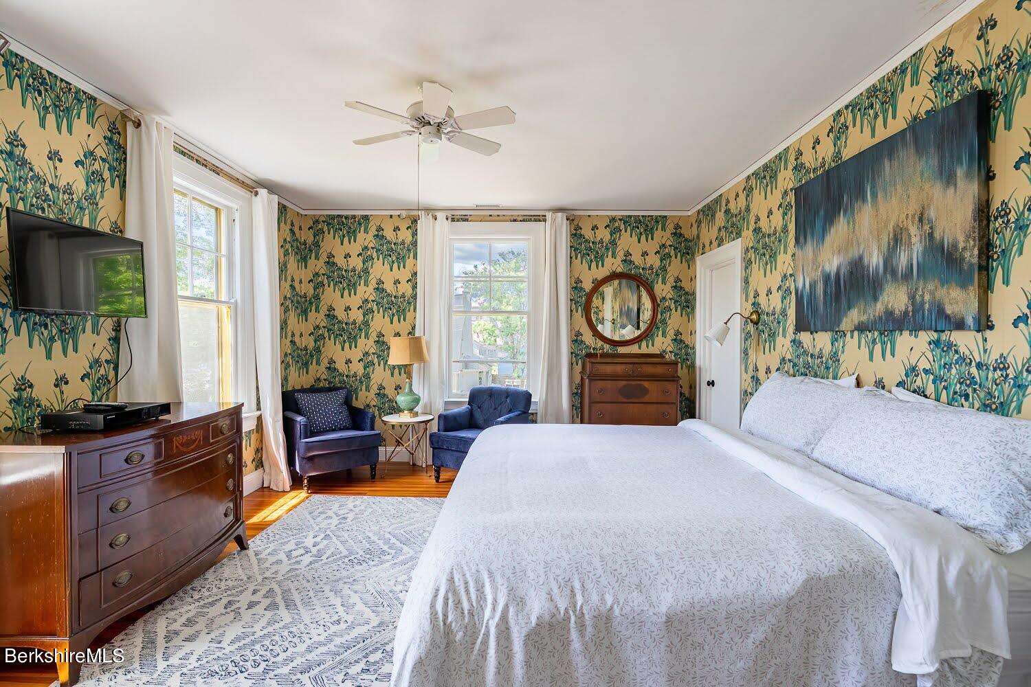 39 Main Street Stockbridge, MA 01262 - Photo 19 of 39 a bedroom with a bed and a flat tv screen on dresser