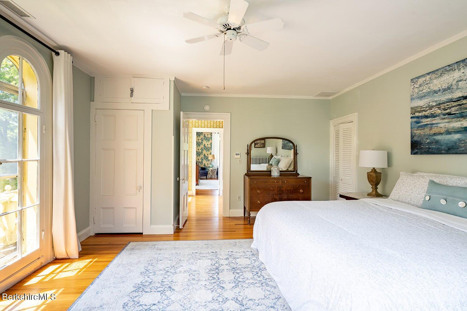 39 Main Street Stockbridge, MA 01262 - Photo 22 of 39 a bedroom with a bed and a chandelier