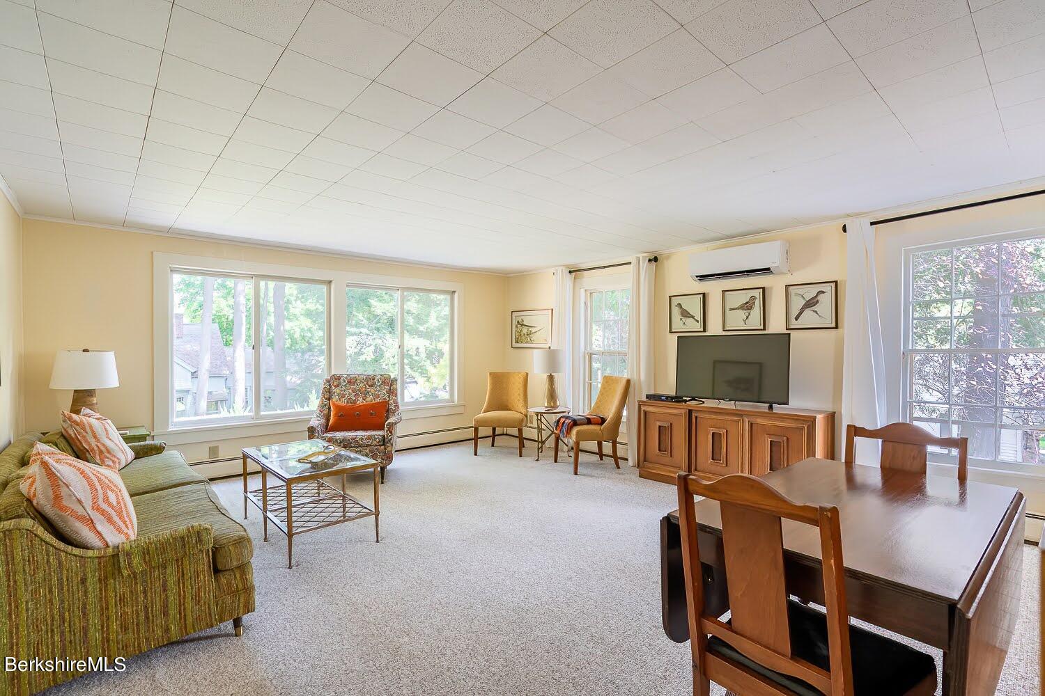 39 Main Street Stockbridge, MA 01262 - Photo 30 of 39 a living room with furniture and a floor to ceiling window