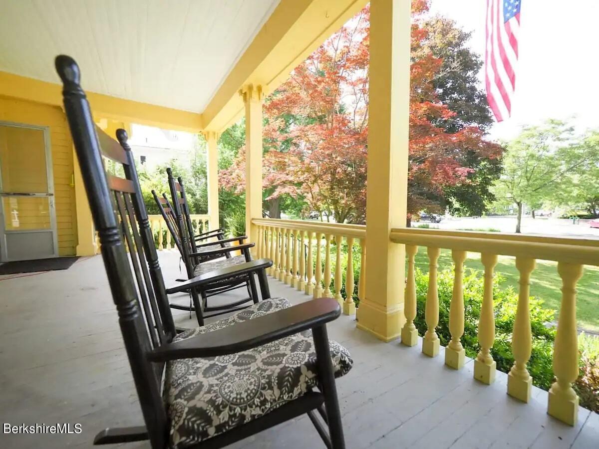 39 Main Street Stockbridge, MA 01262 - Photo 5 of 39 a view of chairs in balcony with wooden floor