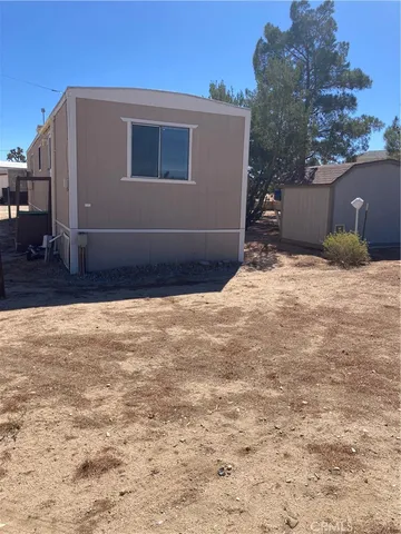 a view of a house with a street