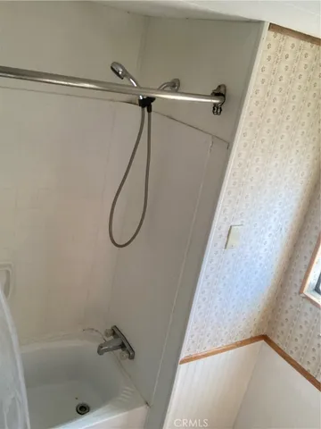 an empty room with wooden floor