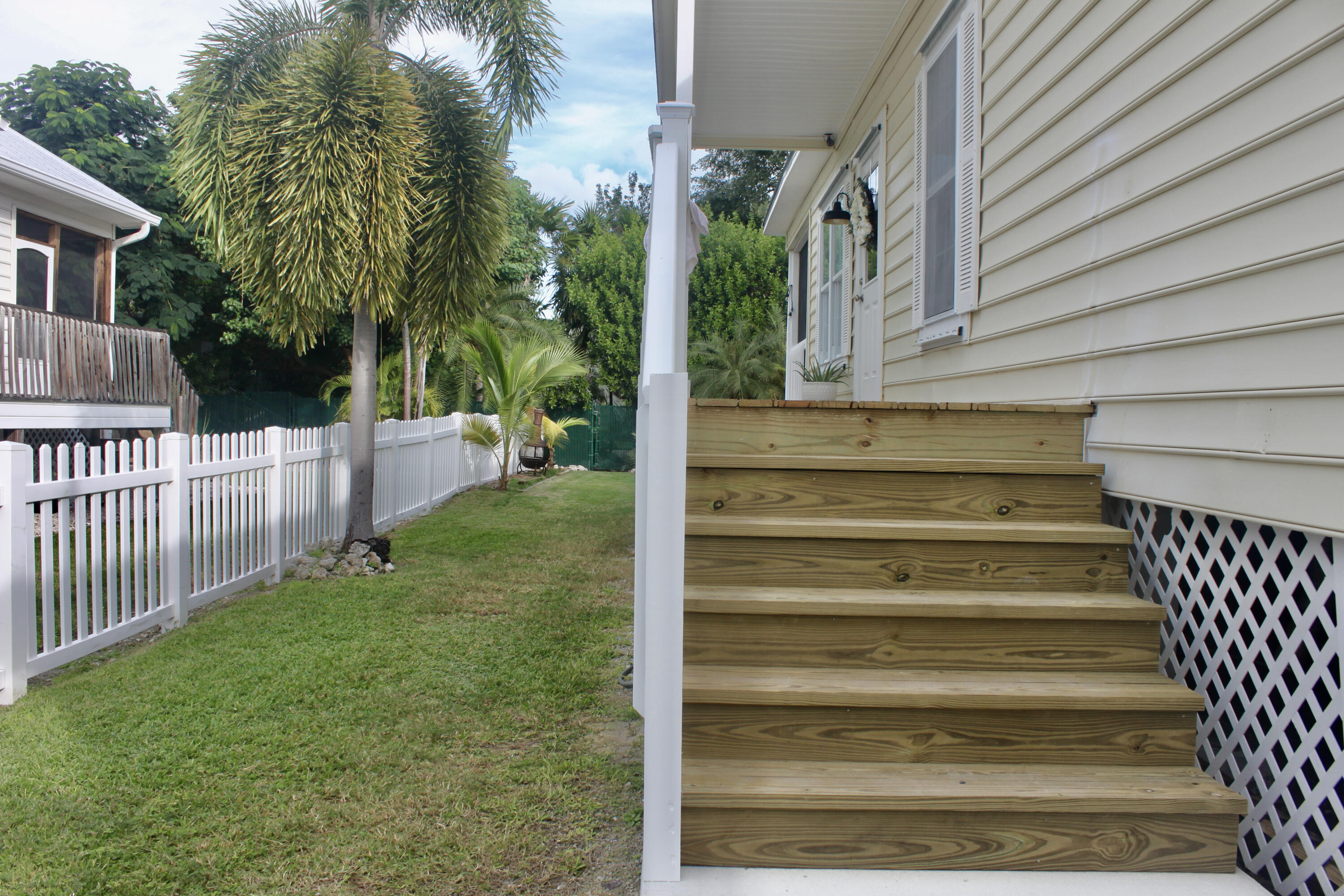 684 92nd Street Marathon, FL 33050 - Photo 52 of 56 a view of backyard with deck and garden