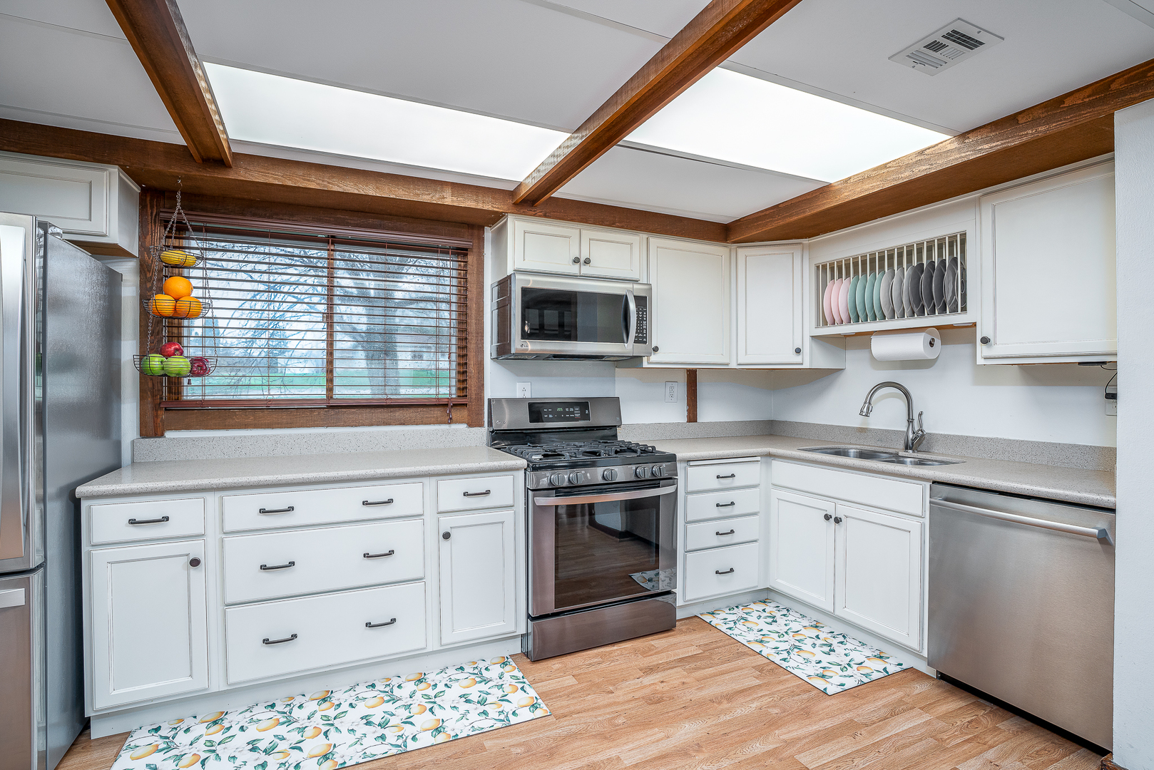 5302 32nd Avenue Moline, IL 61265 - Photo 11 of 30 a kitchen with granite countertop cabinets stainless steel appliances and a window