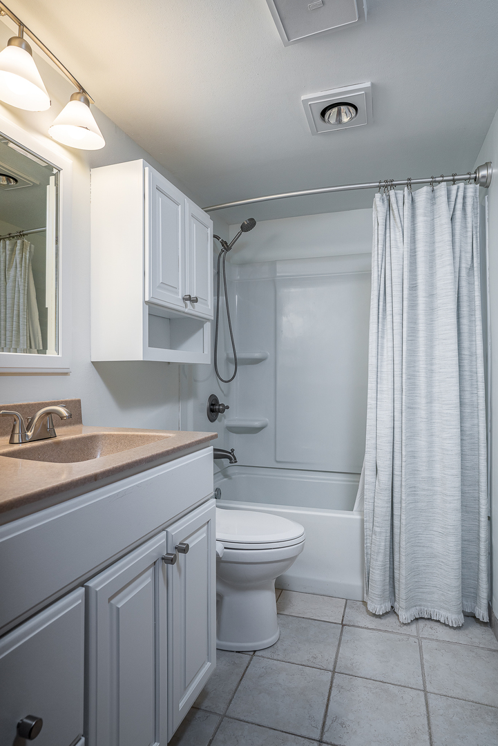 5302 32nd Avenue Moline, IL 61265 - Photo 20 of 30 a bathroom with a sink a toilet and shower