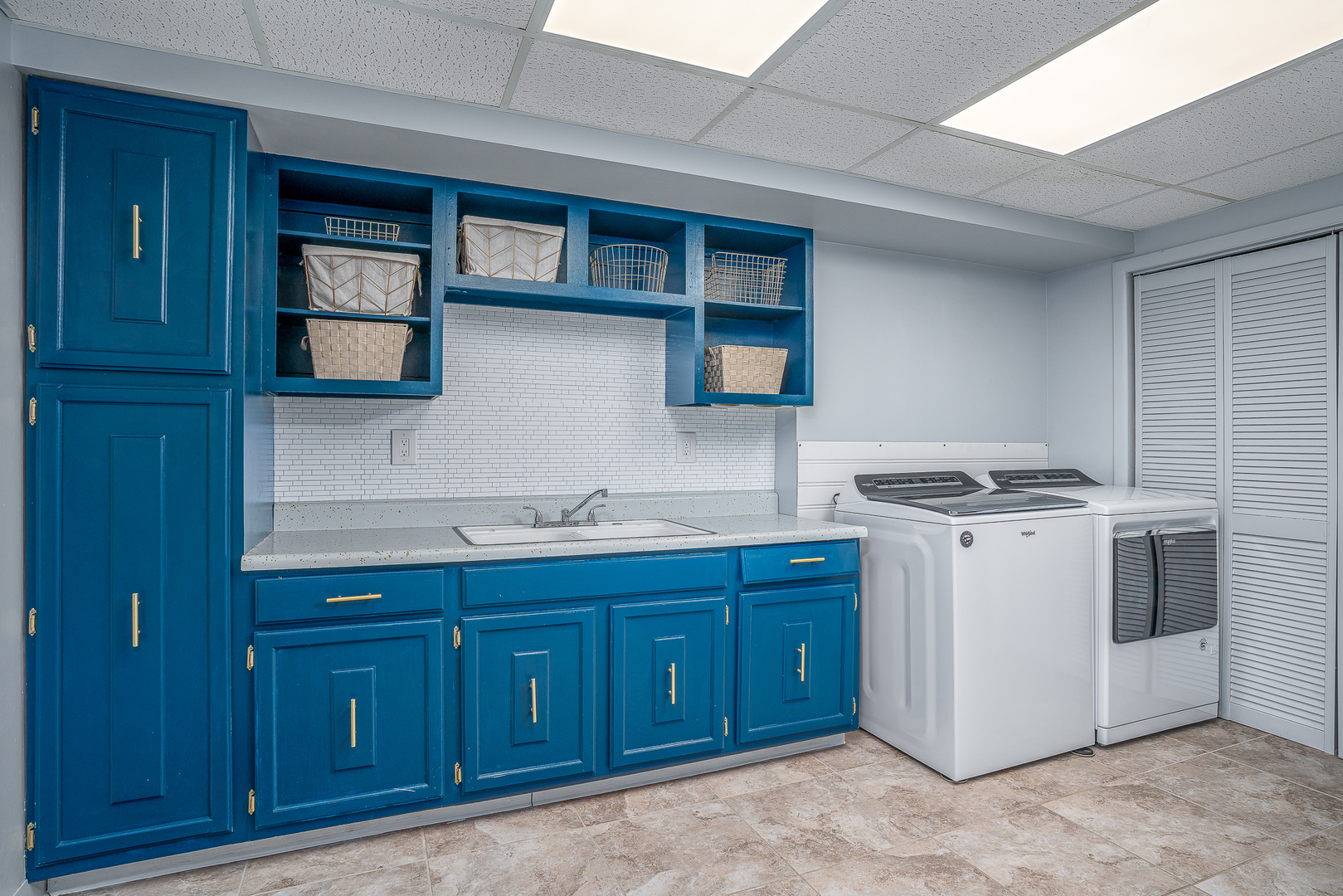 5302 32nd Avenue Moline, IL 61265 - Photo 24 of 30 a utility room with wooden cabinets washer and dryer