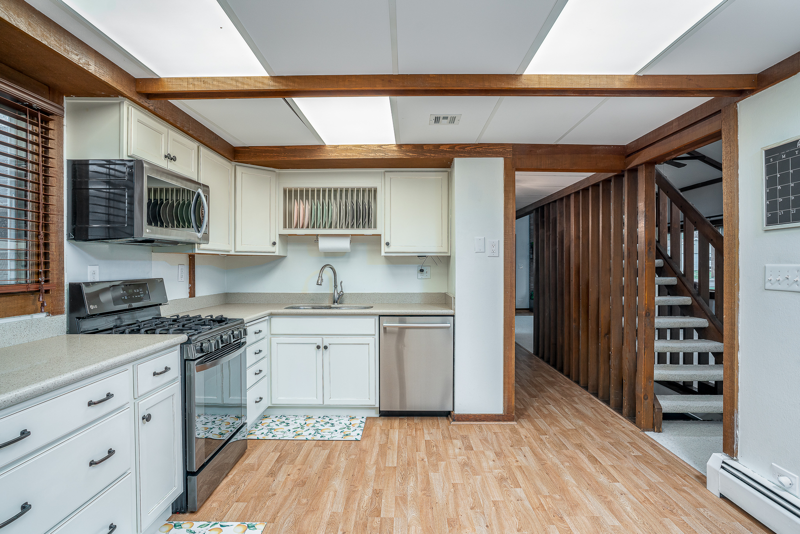 5302 32nd Avenue Moline, IL 61265 - Photo 10 of 30 a kitchen with granite countertop cabinets stainless steel appliances and a counter space