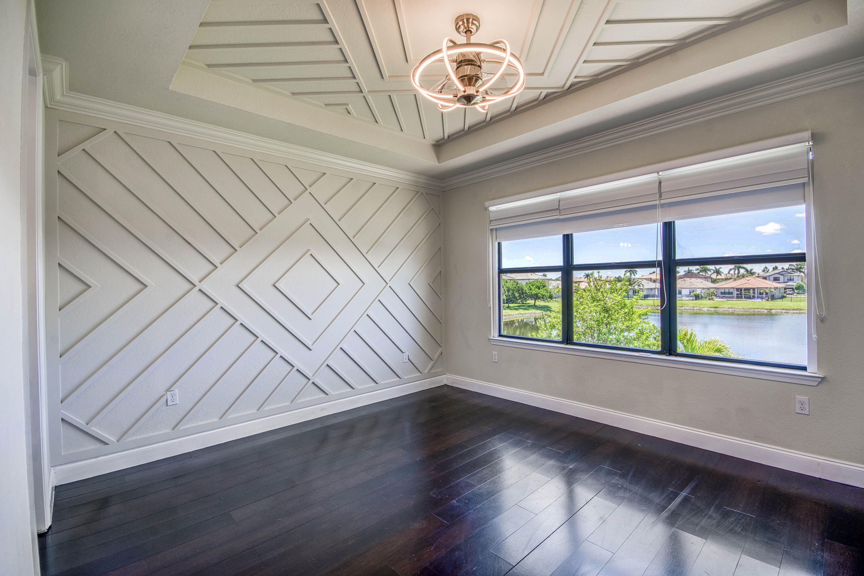 8301 Rearing Lane Lake Worth, FL 33467 - Photo 21 of 33 a view of an empty room with wooden floor and a window
