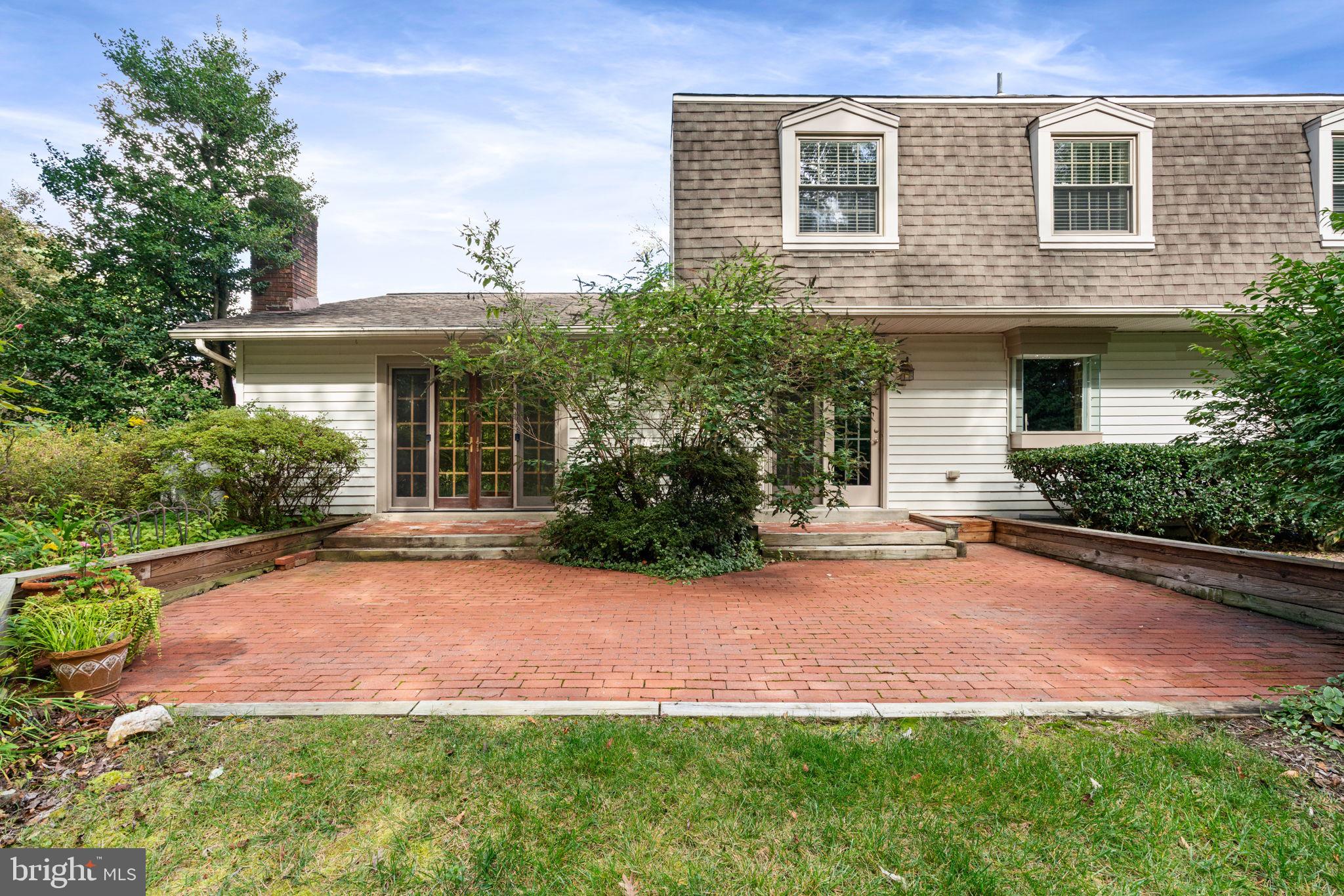 9101 Rural Plains Place Springfield, VA 22153 - Photo 54 of 77 a front view of a house with a yard and garage