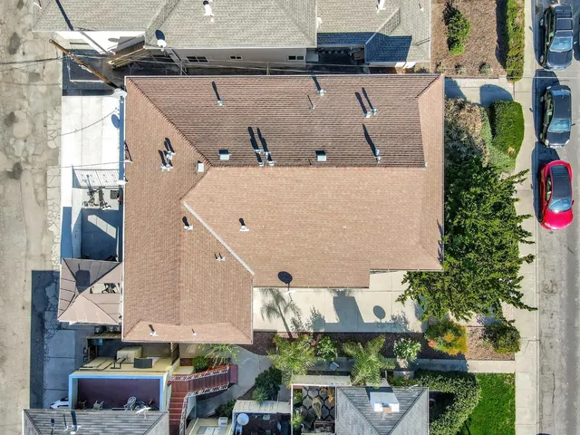 an aerial view of residential building with ocean