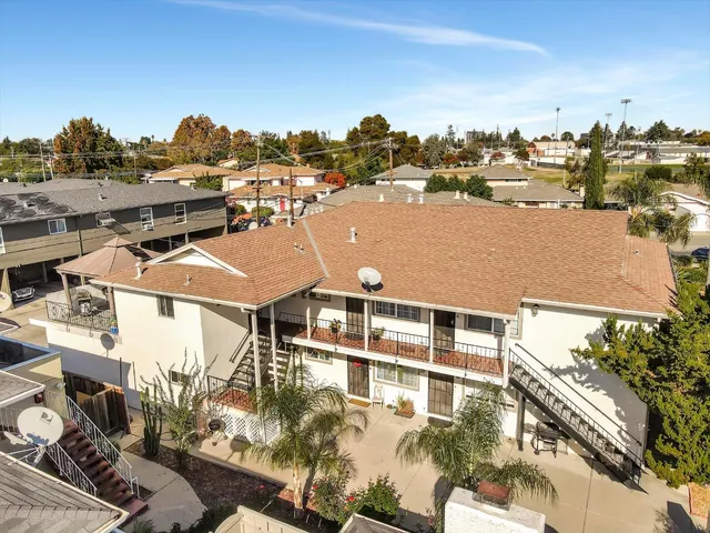 an aerial view of residential houses with outdoor space