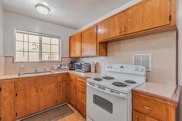 a bedroom with a bed and a ceiling fan