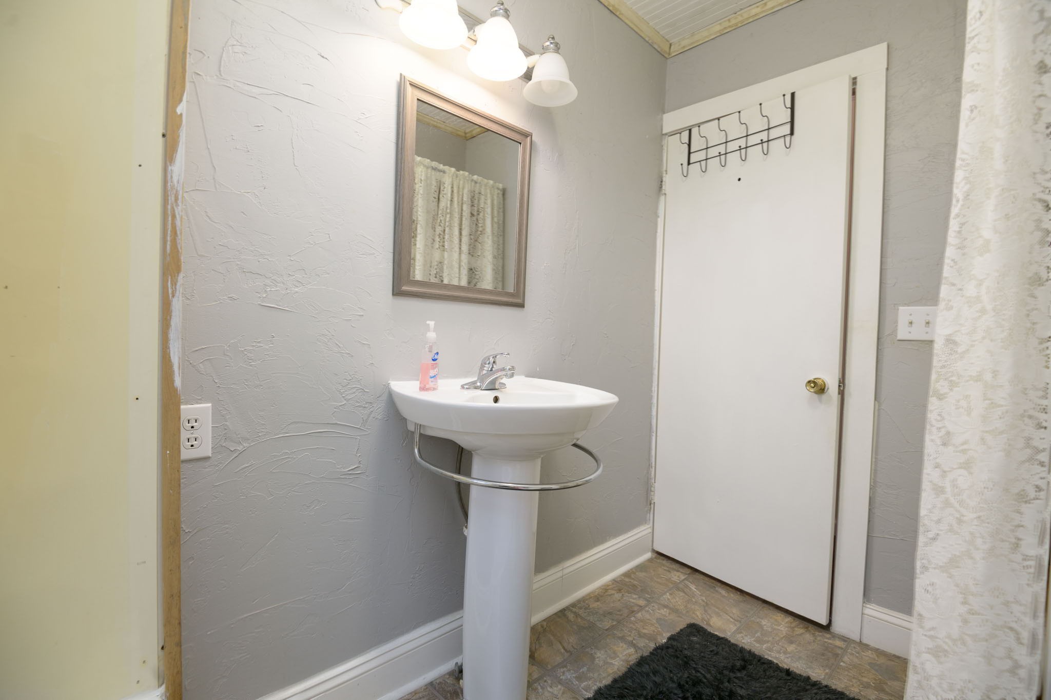 371 Old Liberty Road Alexandria, TN 37012 - Photo 54 of 66 a bathroom with a sink a mirror and shower