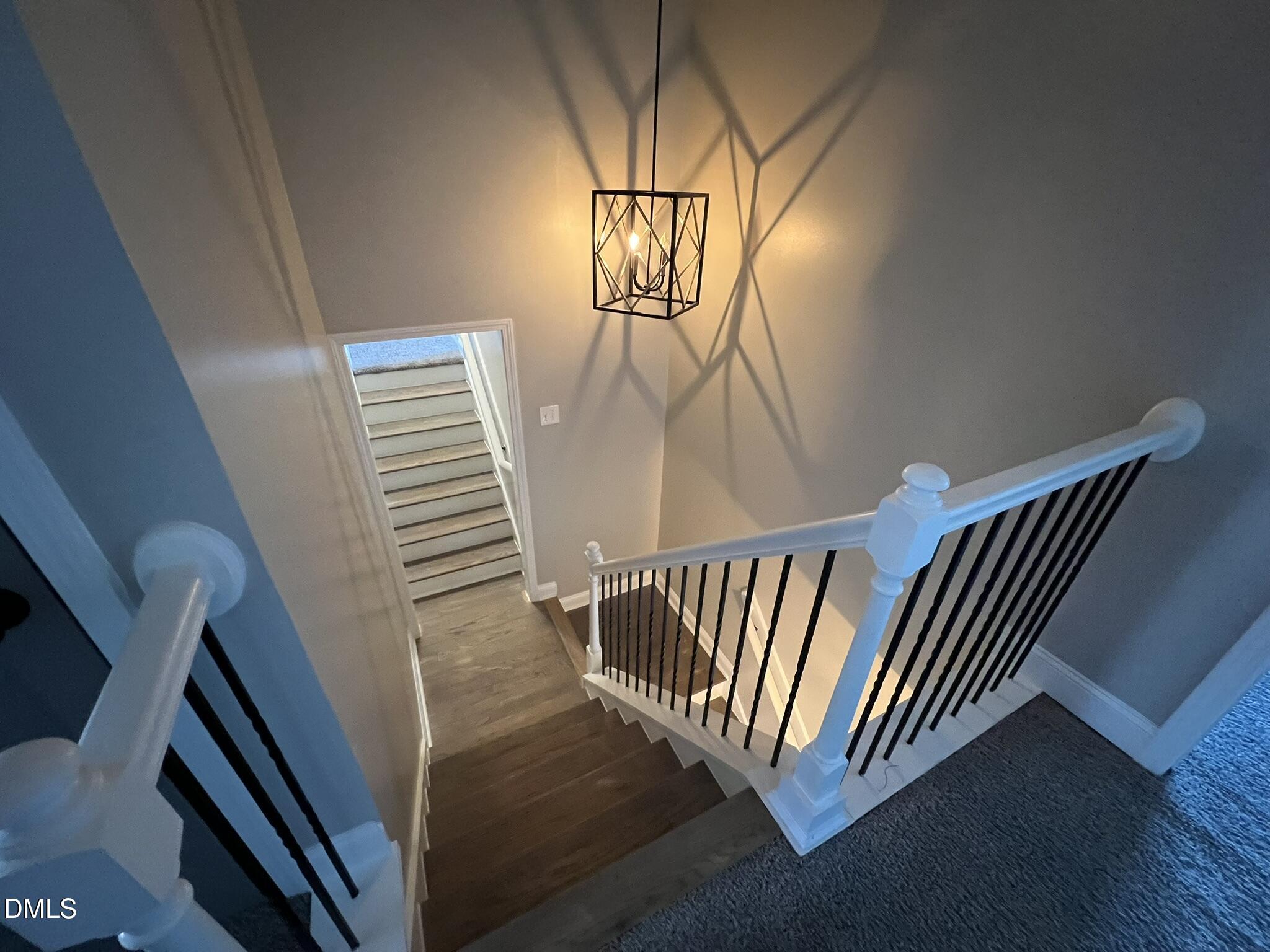 19 Eaton Drive Angier, NC 27501 - Photo 11 of 17 a view of staircase with wooden floor and fan