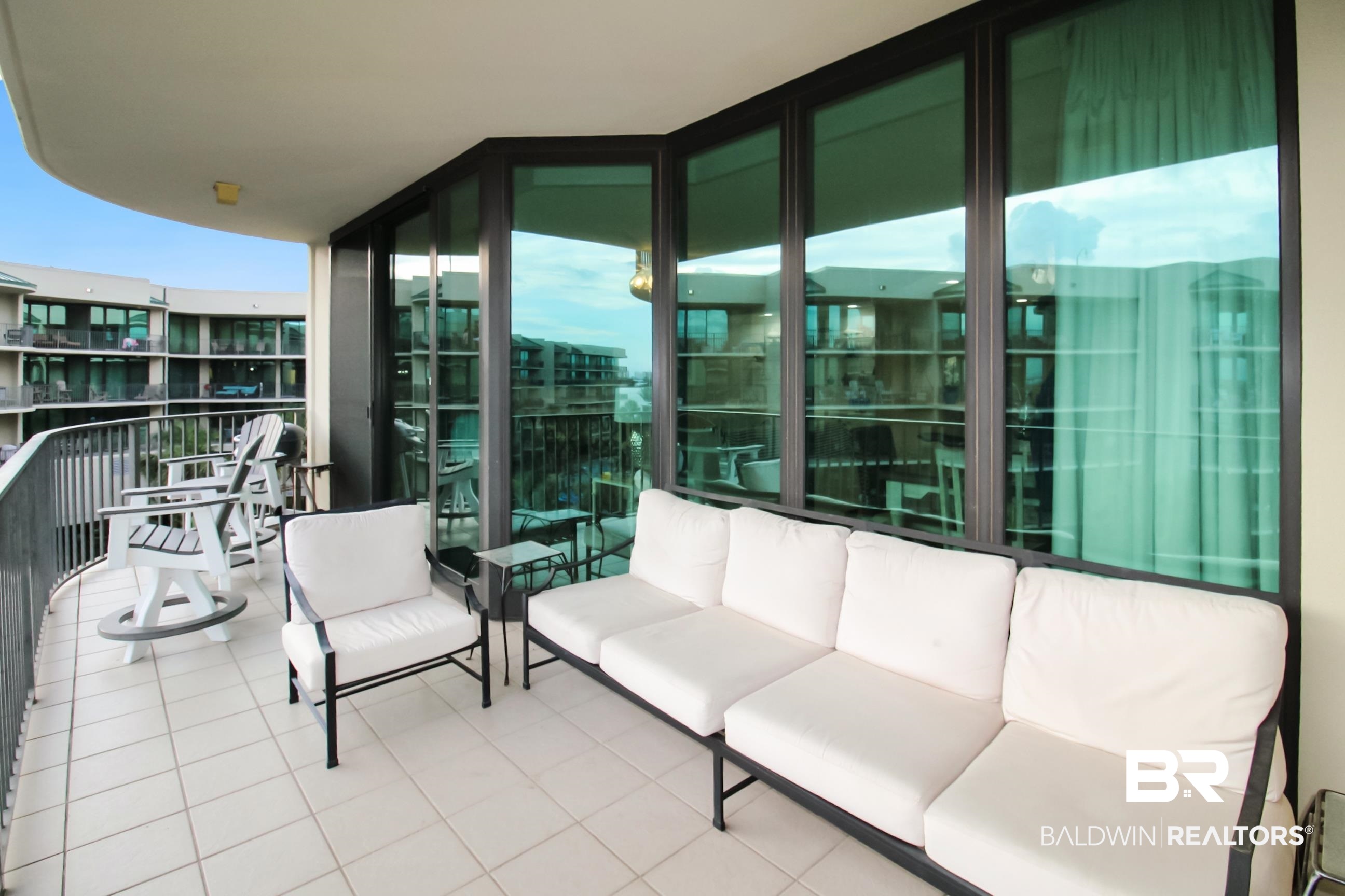 27580 Canal Road, Unit 1425 Orange Beach, AL 36561 - Photo 23 of 28 Balcony with an outdoor living space and a sunroom