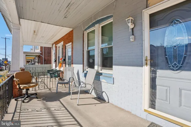 a view of a patio with table and chairs and potted plants