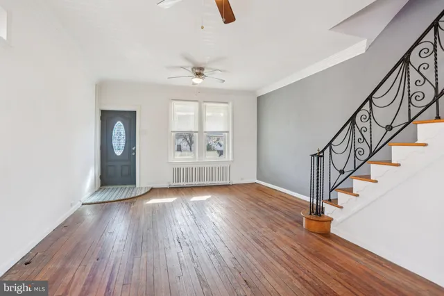 a view of an entryway with wooden floor