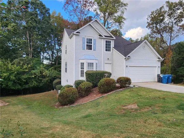 a view of a house with a back yard