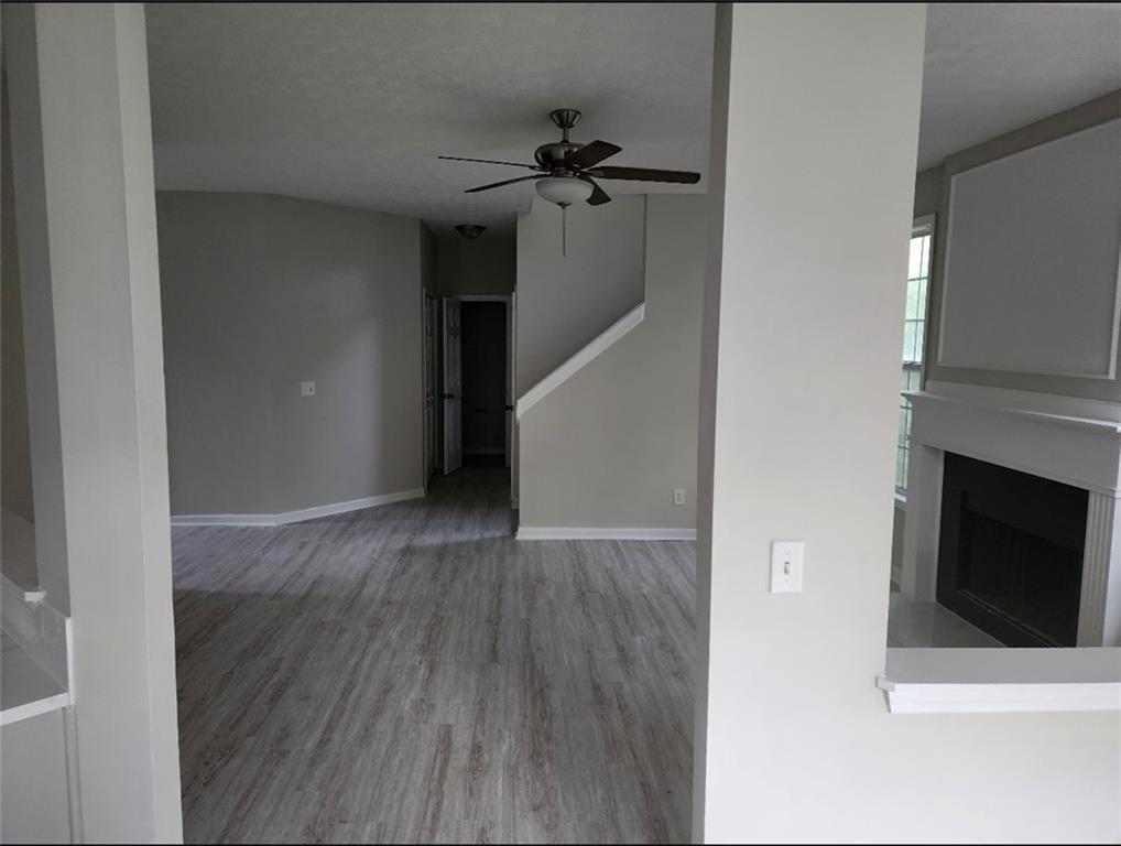 138 Shady View Place Lawrenceville, GA 30044 - Photo 3 of 21 a view of a livingroom with wooden floor and a ceiling fan
