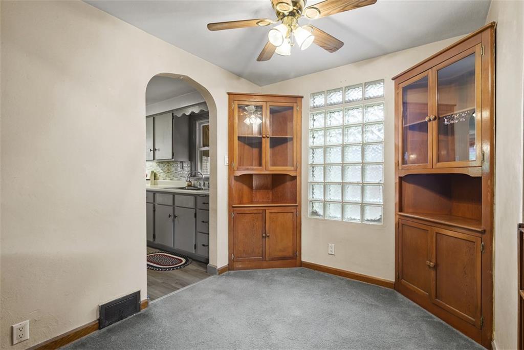 1233 Virginia Avenue Midland, PA 15059 - Photo 11 of 44 an empty room with windows and cabinet