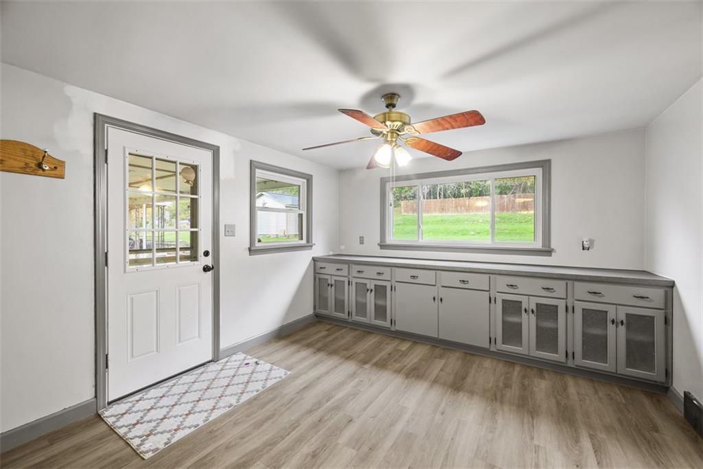1233 Virginia Avenue Midland, PA 15059 - Photo 16 of 44 a large white kitchen with a window