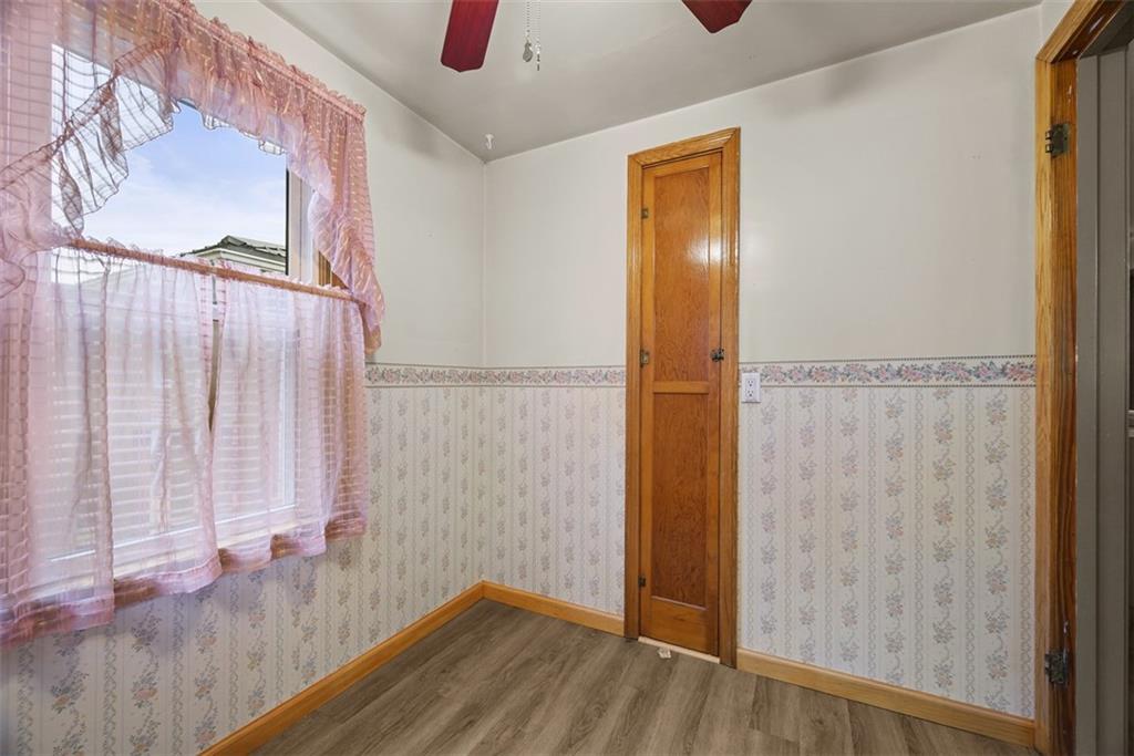 1233 Virginia Avenue Midland, PA 15059 - Photo 19 of 44 a view of a hallway with wooden floor and closet